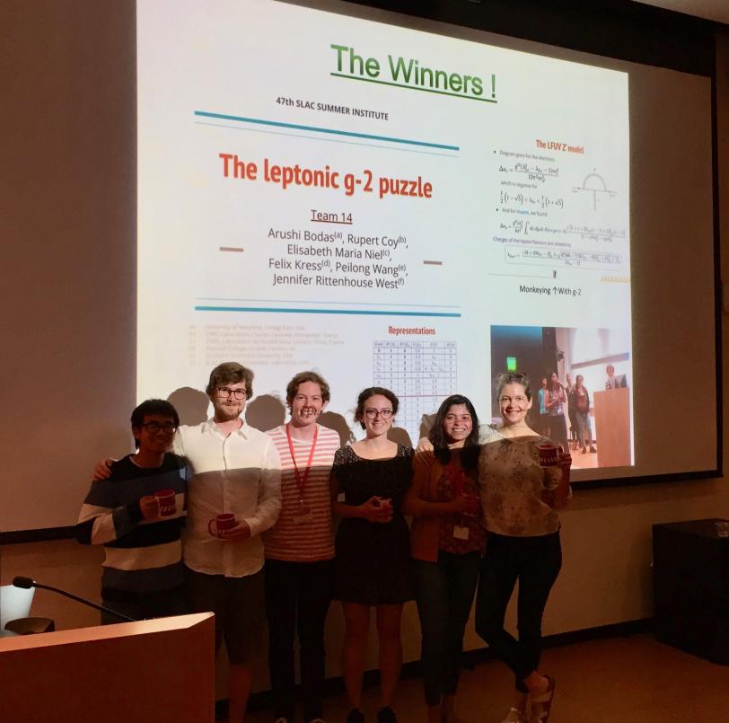 content winners posing in front of their presentation