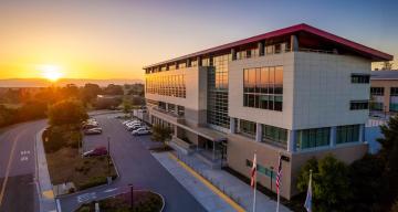 exterior of SUSB building as sun rises in the morning