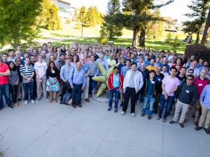 group photo of attendees standing outside on SLAC's campus
